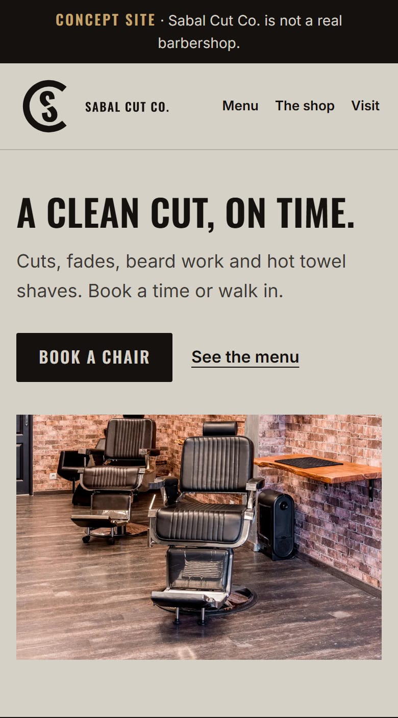 The Sabal Cut Co. home page on a phone: the headline "A clean cut, on time," a book button, a menu button and a barbershop photo.