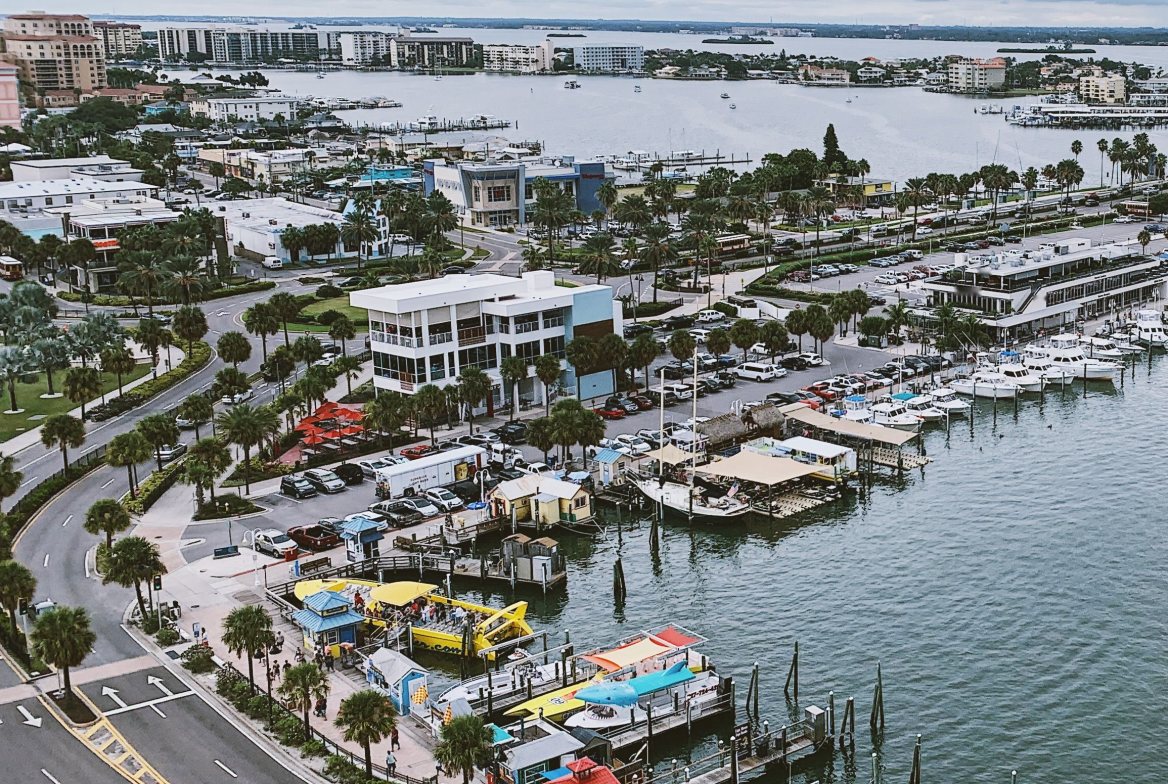 Clearwater harbor and marina from above, palms along the waterfront road