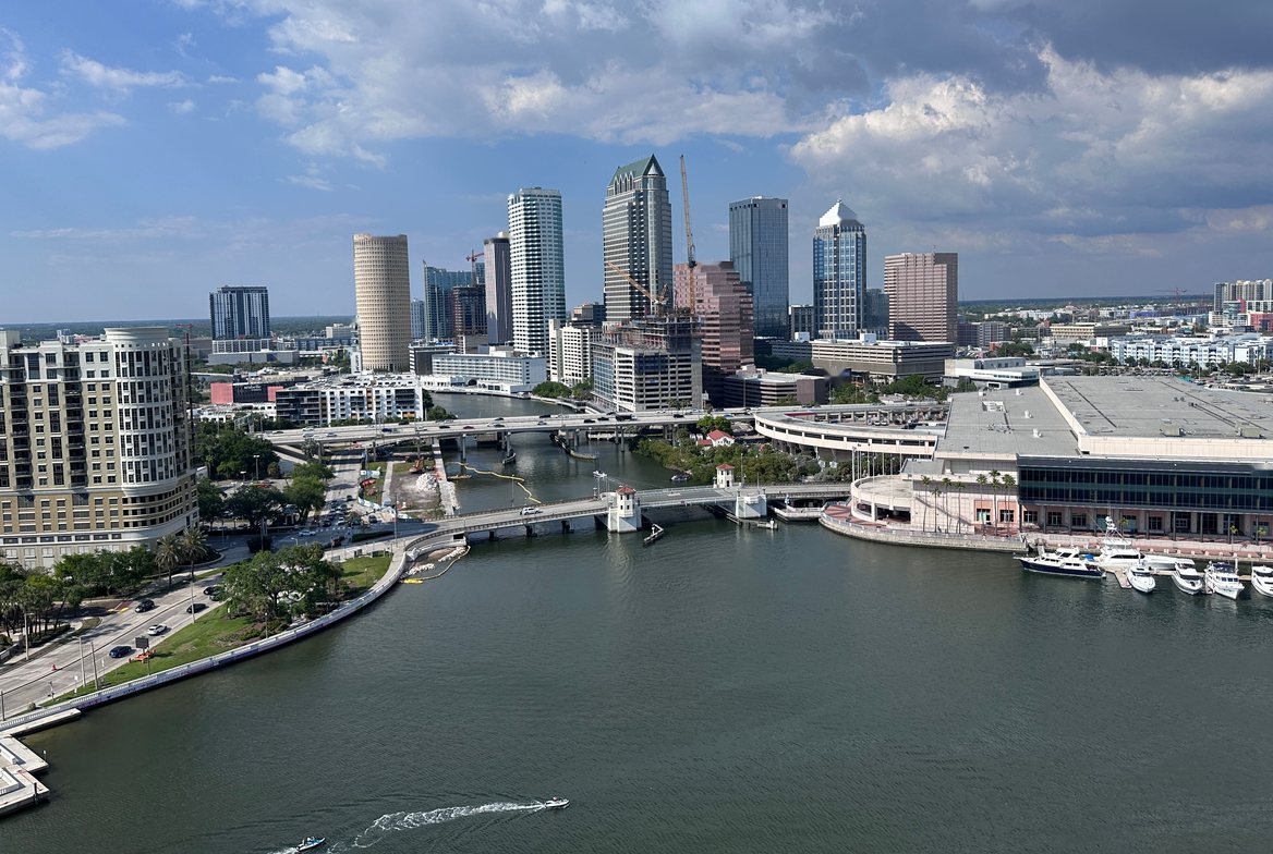 Downtown Tampa across the channel from above, with Harbour Island&rsquo;s towers at left and boats at the convention center docks
