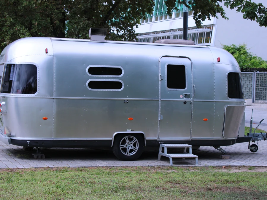 Silver travel trailer, washed and polished