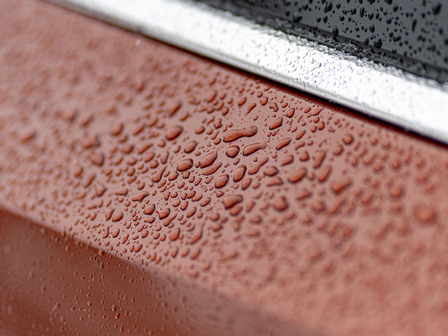 Water beading on freshly sealed bronze paint