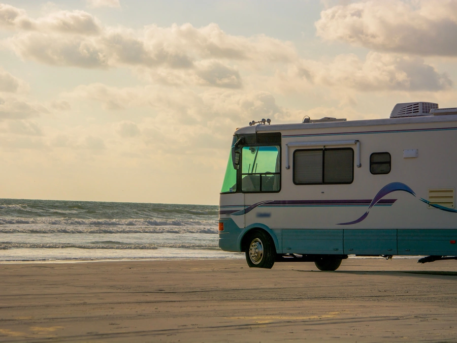 Motorhome with a clean exterior parked on a beach