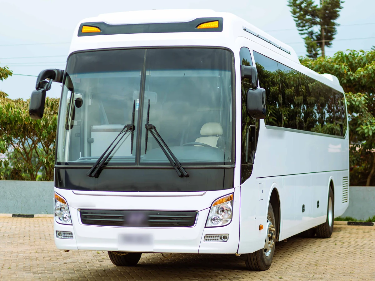 White passenger bus, clean and parked