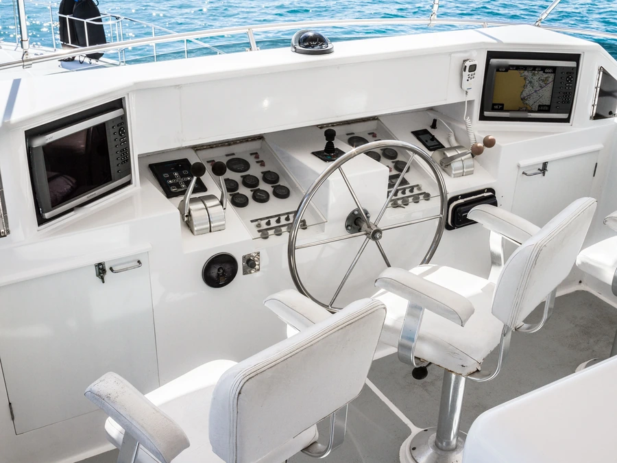 White boat helm and seats on open water